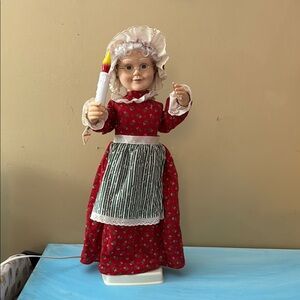 Red and White Doll with Candle
